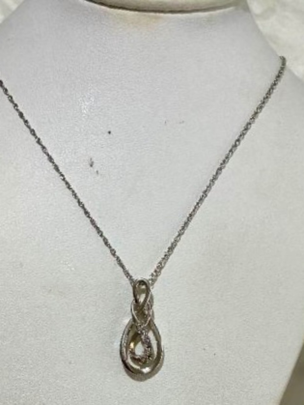 Sterling silver necklace/pendant, pendant has eternity design, signed 925 RL